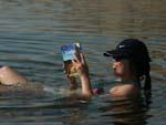 Dead Sea - Sonya reading the Jordan Lonely Planet in the Dead Sea