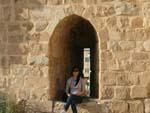 Kerak Castle - Sonya sitting on a weapon hole