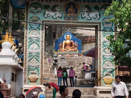 The east entrance gate at the base of the hill with stairs leading up to the temple