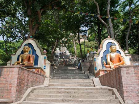 Buddha statues flanking the entrance to the Monkey Temple