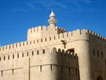 Nizwa Fort with the mosque's minaret in the background