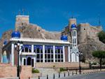Al Khawr mosque with the Al Mirani Fort in the background