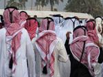 Men wearing traditional Keffiyeh leaving the parade