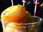 Deep fried balls of pastry in syrup