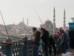 Fishermen with mosques in background